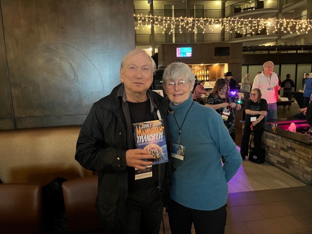 Two Of My Favorite People! John and Karen Stith. John Is Holding His Book That Is On It's Way Into A Film! COSine 2024 Author Signing. (© 2024, F. P. Dorchak)